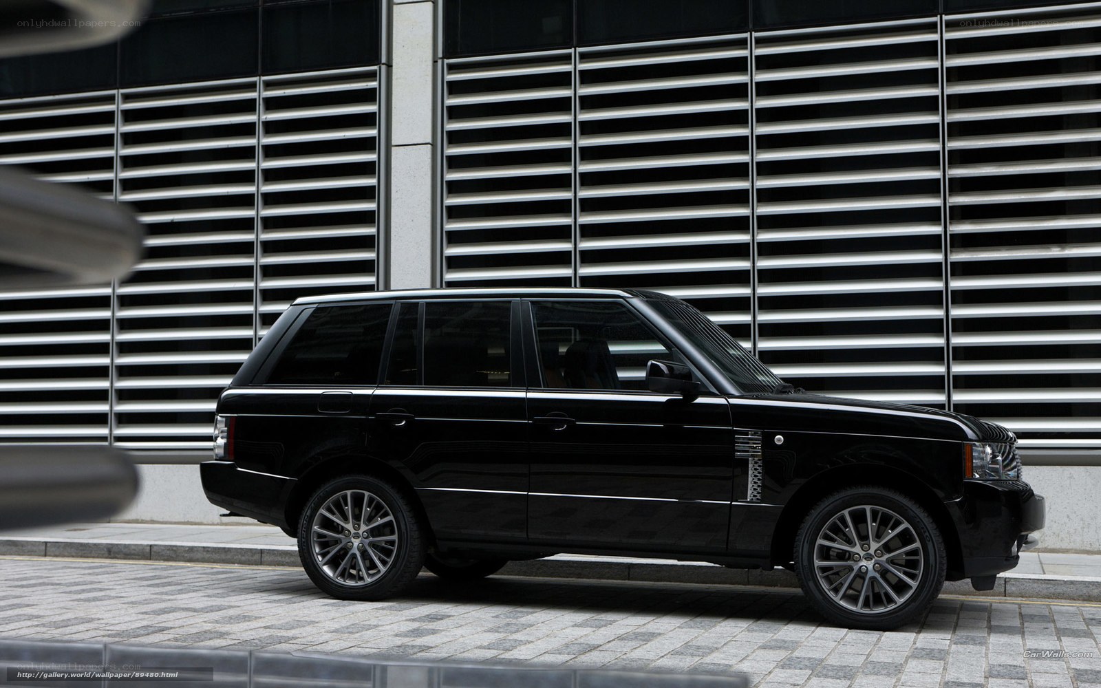 Black Range Rover on city street