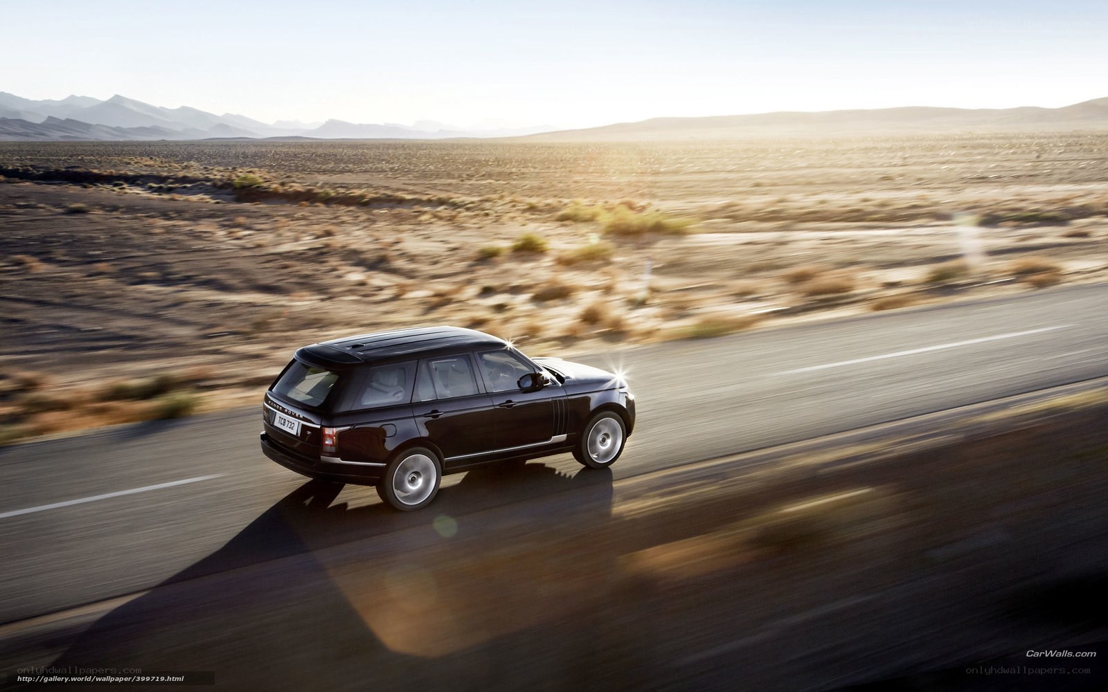 black range rover on desert road