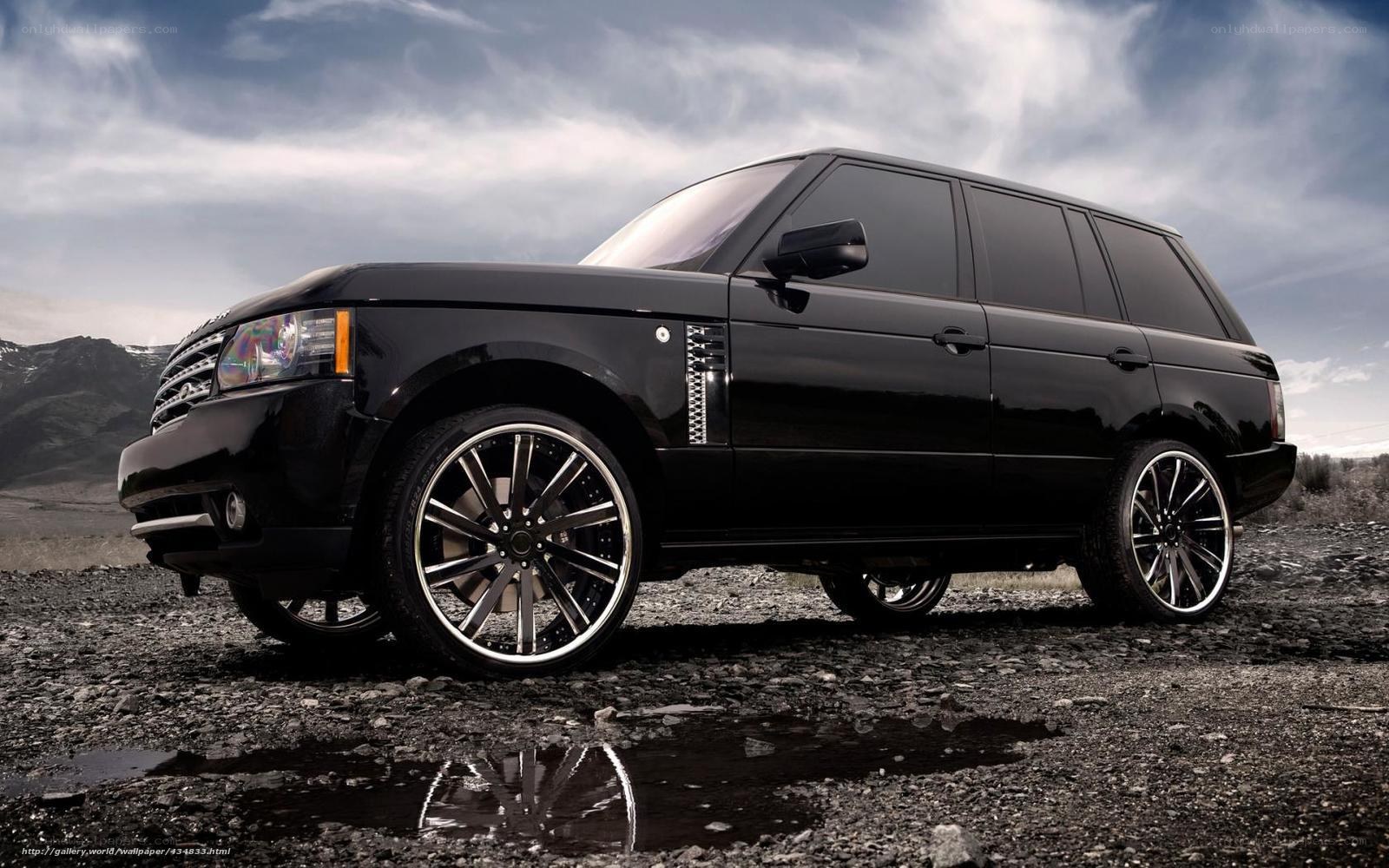 Black Range Rover on gravel