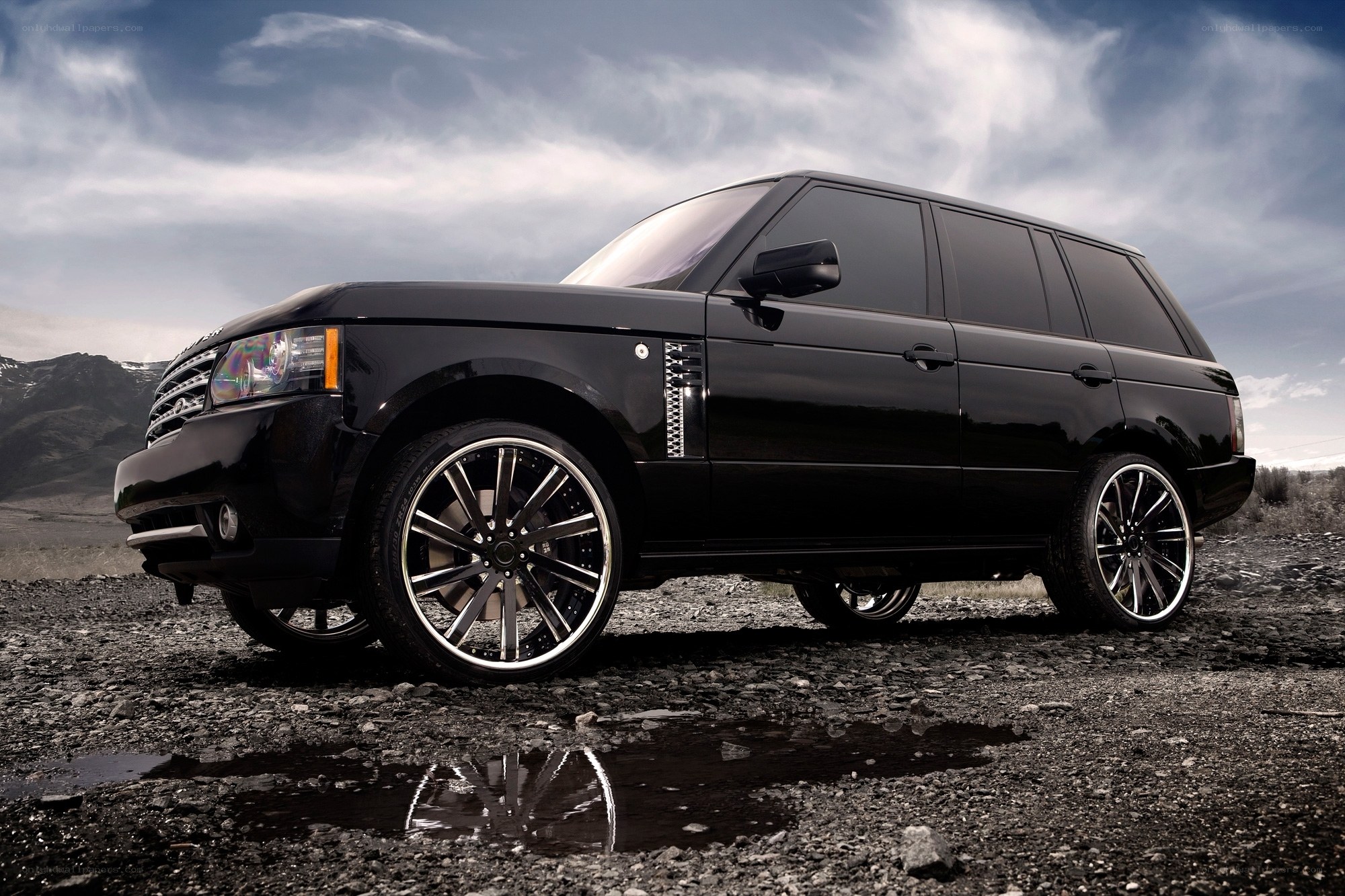 Black Range Rover on gravel