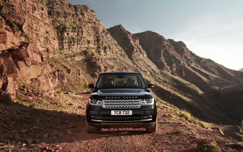 Black Range Rover on mountain trail