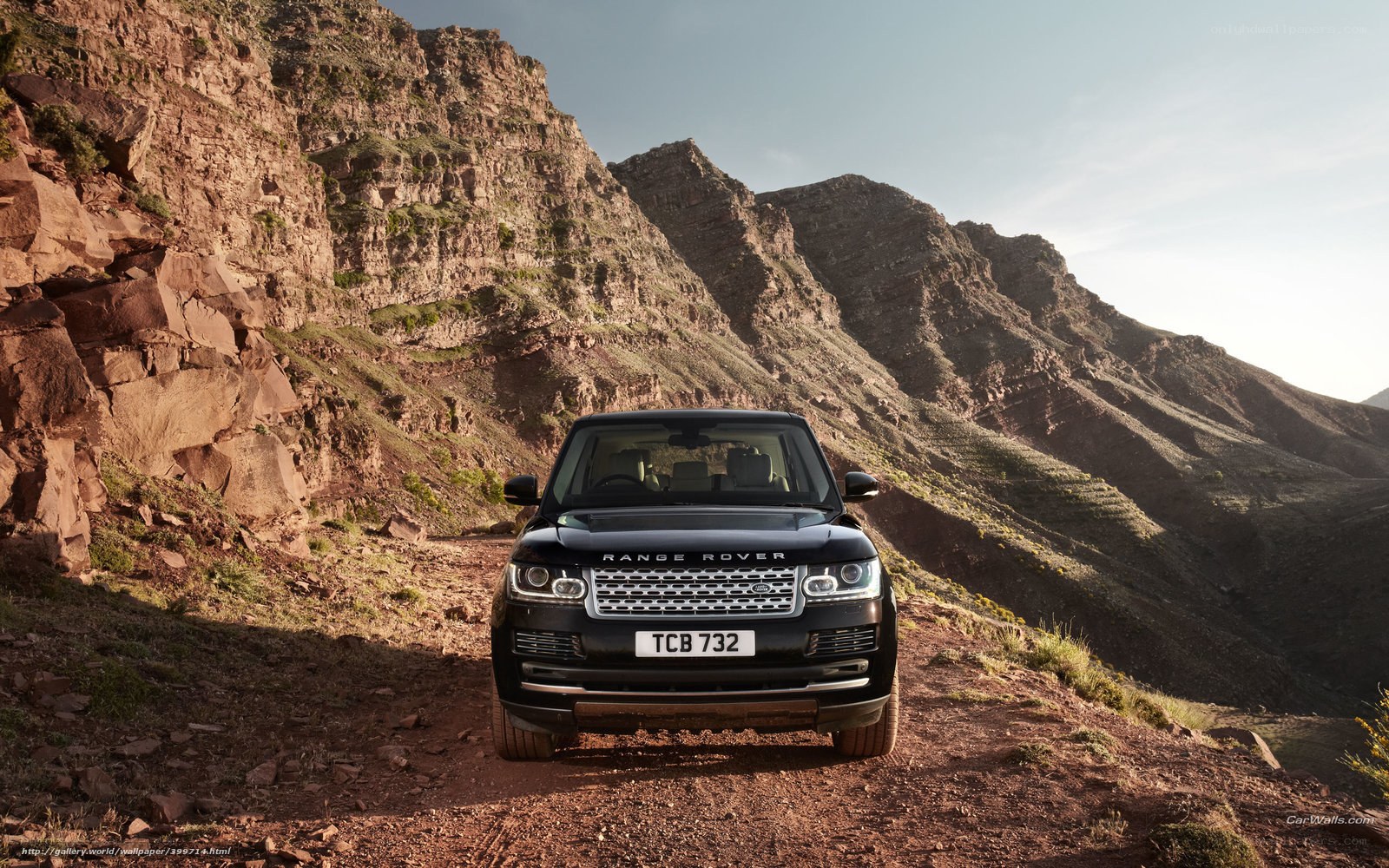 Black Range Rover on mountain trail