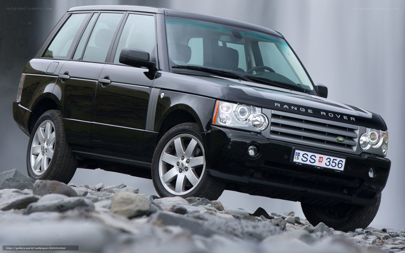 Black Range Rover on rocky terrain