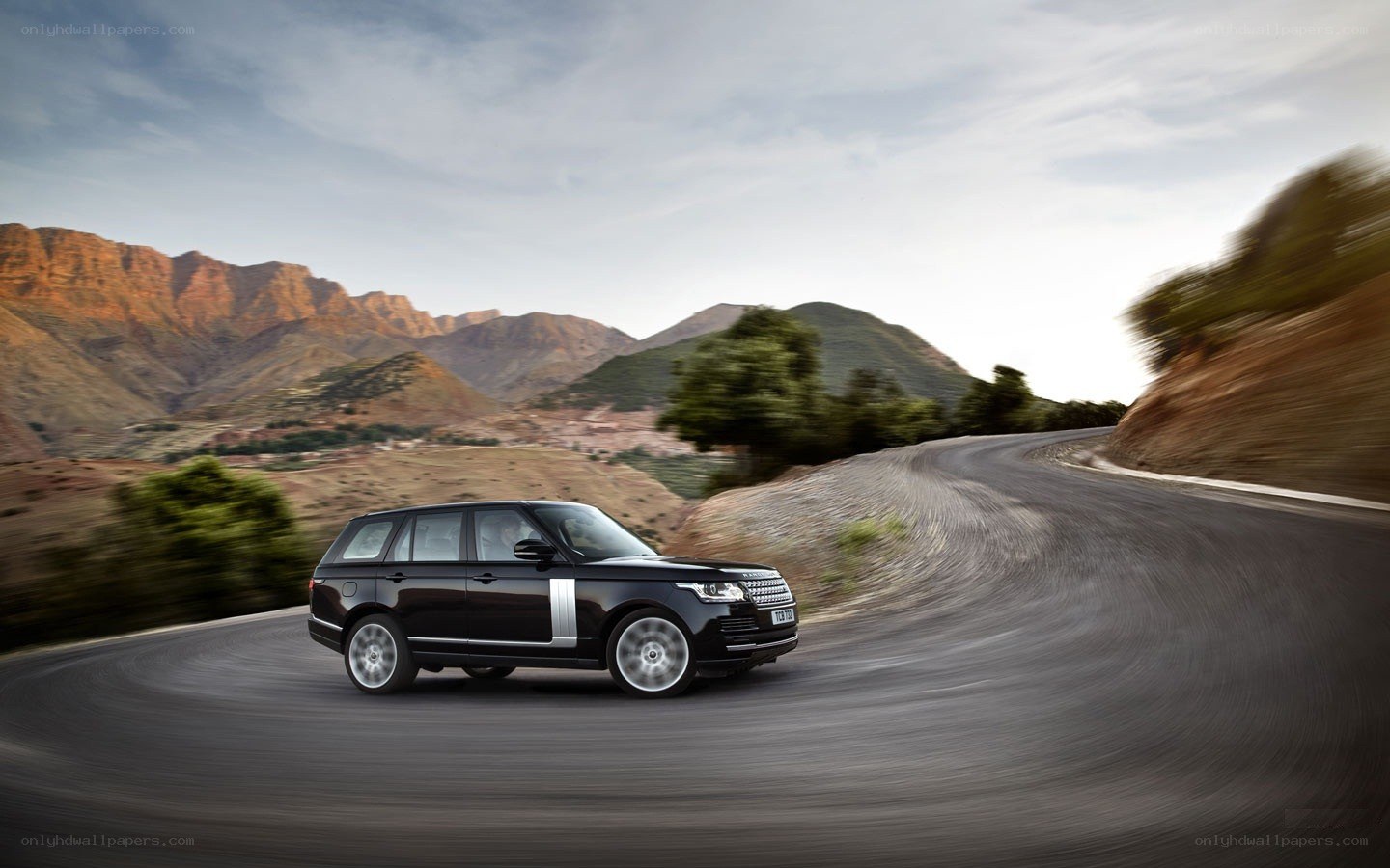 Black Range Rover on winding road