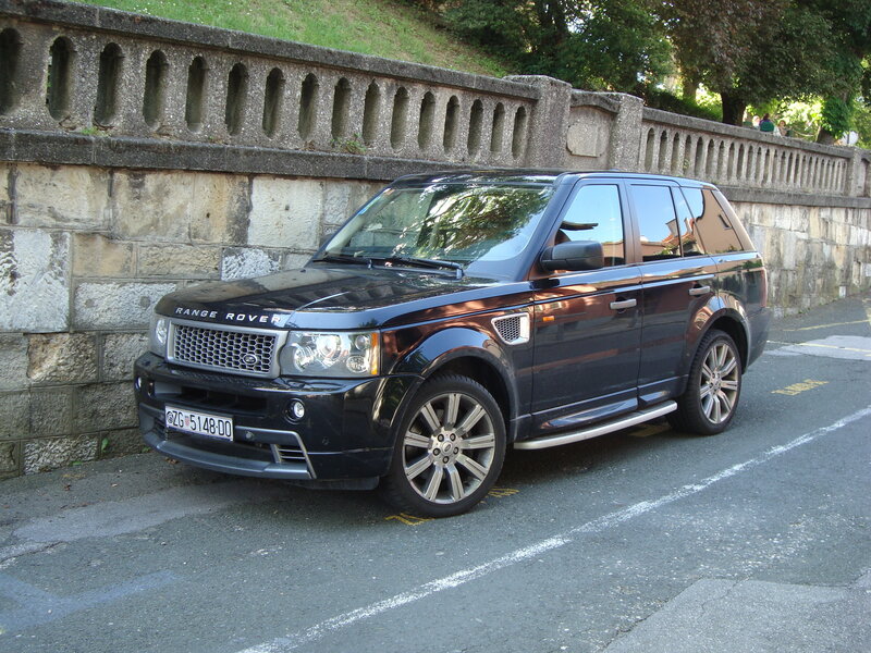 Black Range Rover parked on street