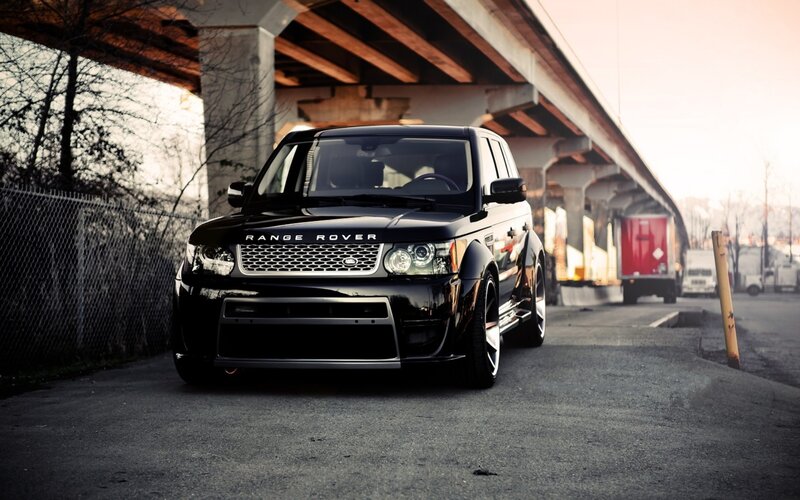 Black Range Rover under overpass