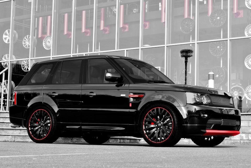 black range rover with red accents