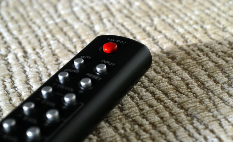 black remote on carpet