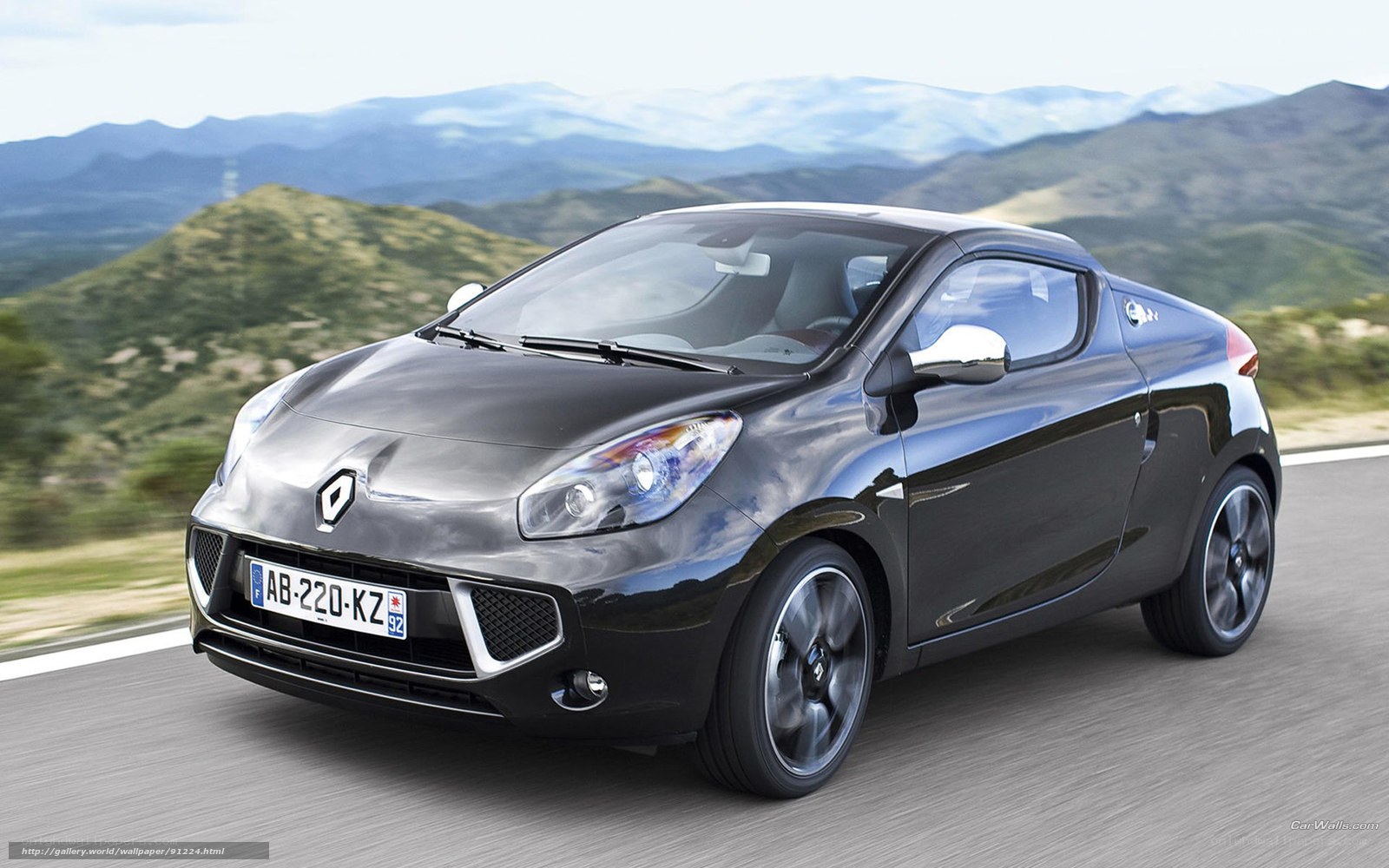 Black Renault car on mountain road