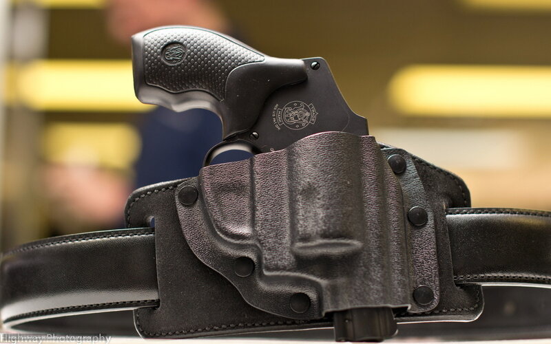 Black revolver in holster