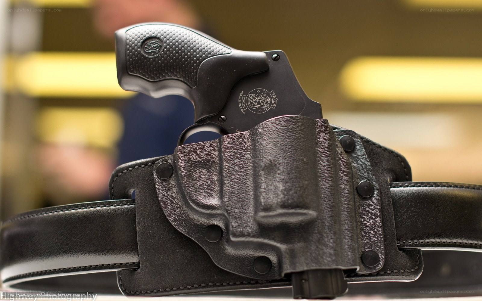Black revolver in holster