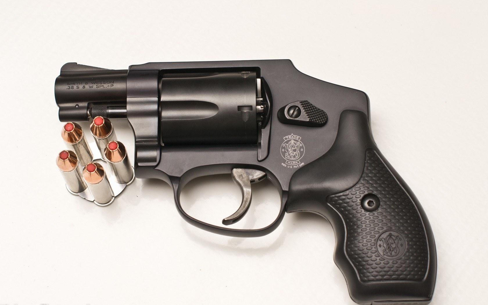 Black revolver with bullets