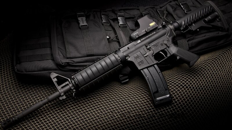 Black Rifle on Bag — Dramatic