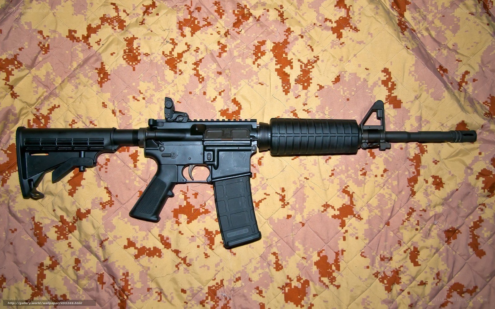 black rifle on camouflage