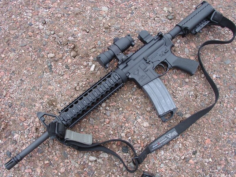 Black Rifle on Gravel — Neutral, Photograph