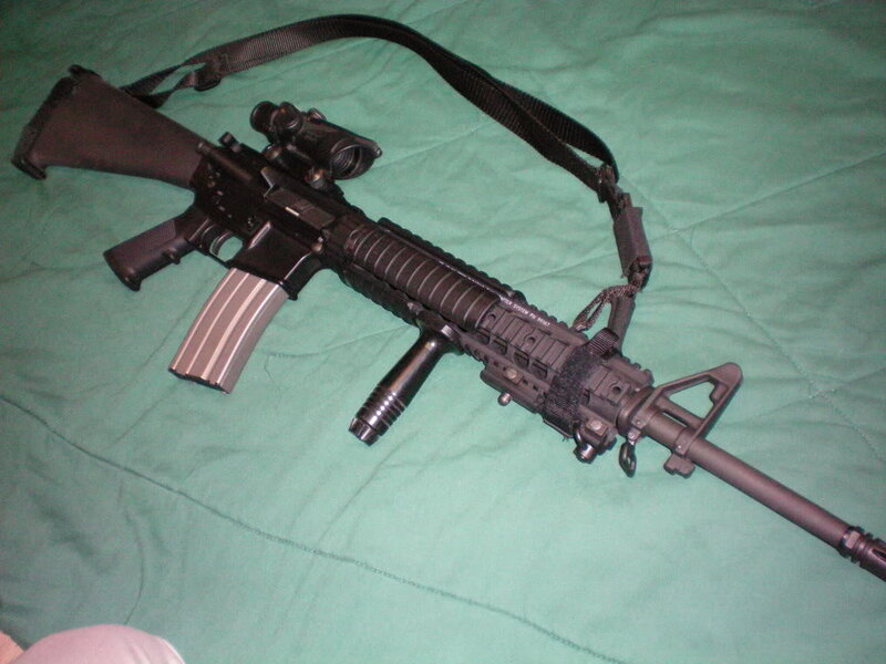 Black Rifle on Green Fabric