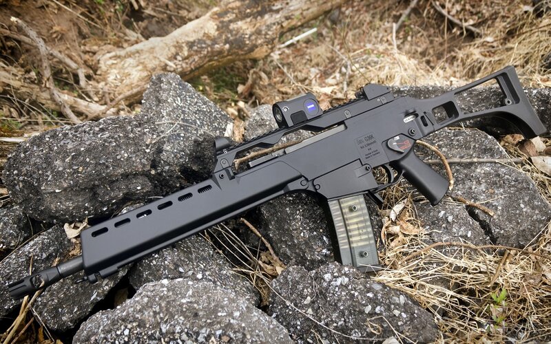 Black rifle on rocks