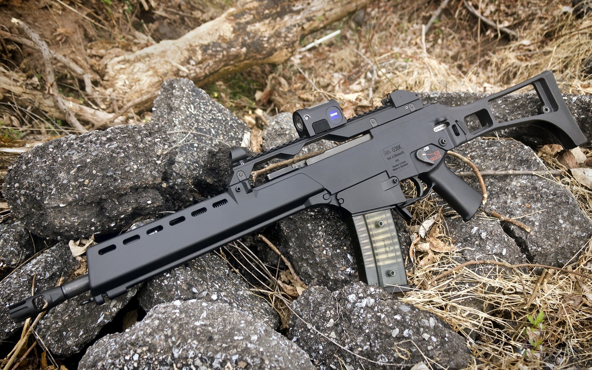 Black rifle on rocks