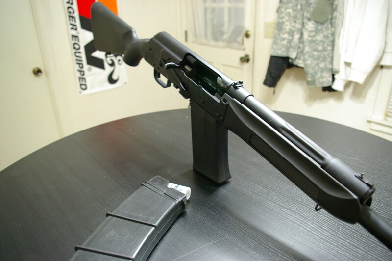 black rifle on table