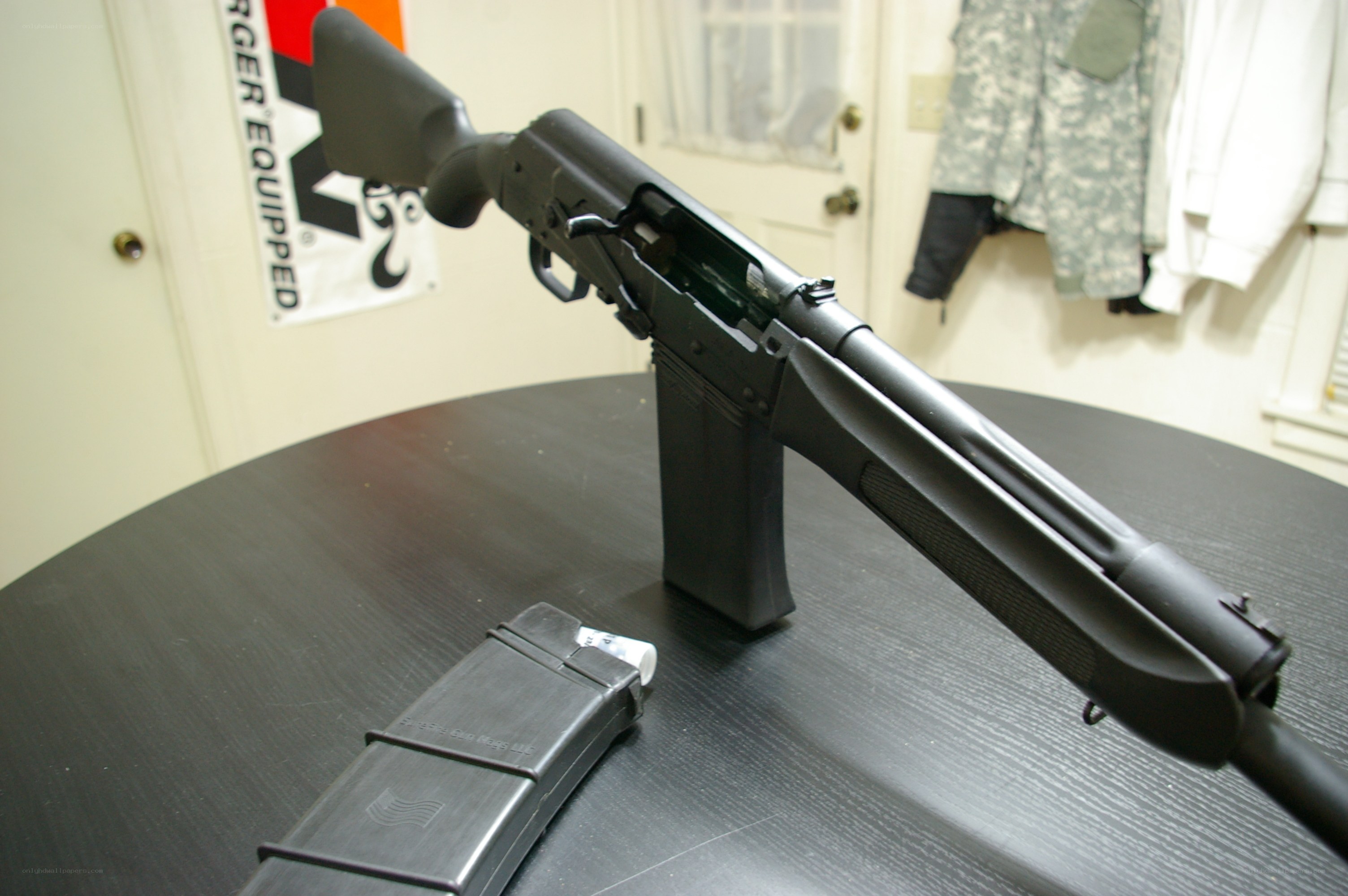 black rifle on table