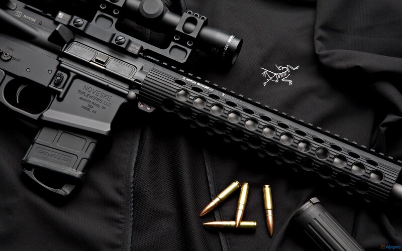 Black rifle with scope and ammunition