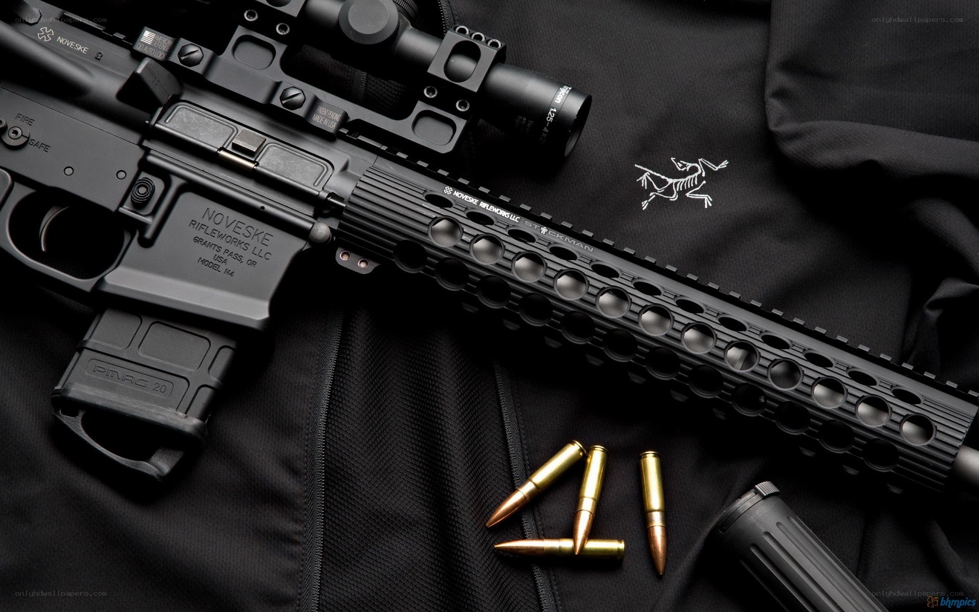 Black rifle with scope and ammunition
