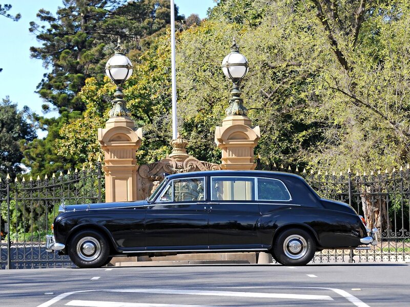 Black Rolls-Royce at a grand entrance