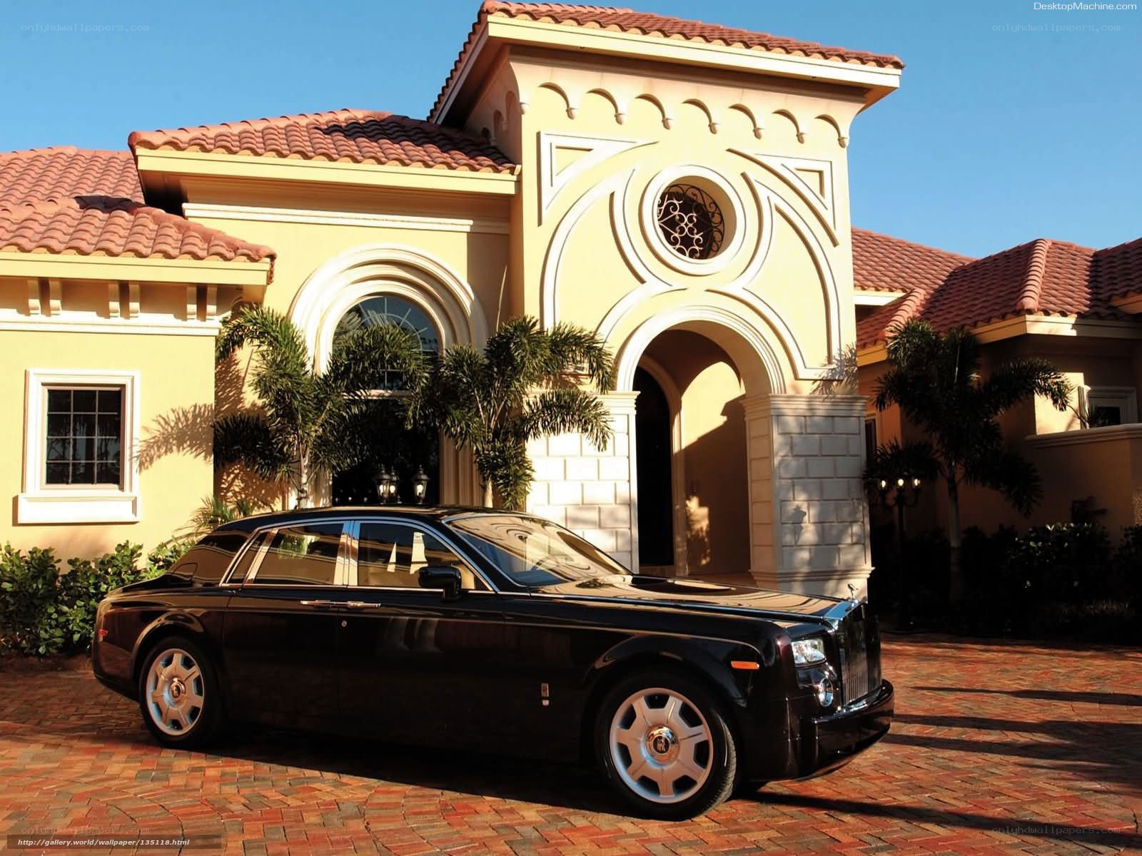 Black Rolls-Royce at luxury home
