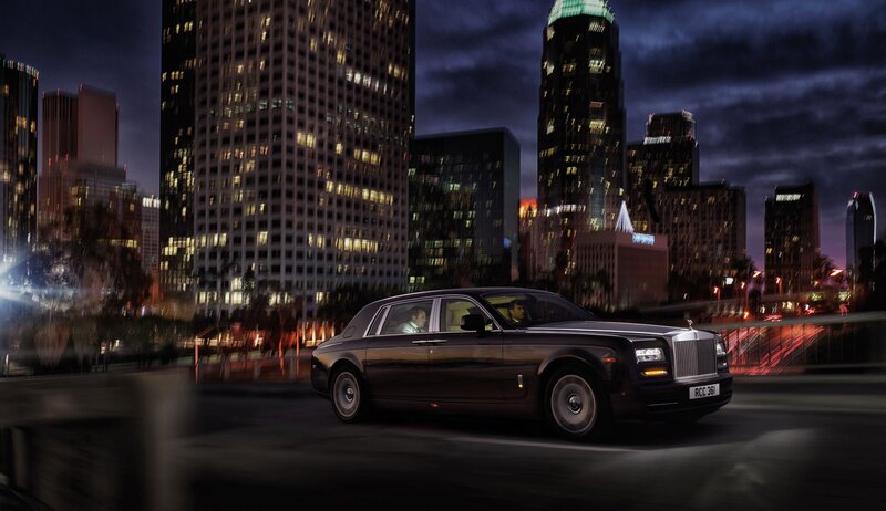 Black Rolls-Royce Car — Dramatic, Night, Photograph, City Skyline, Buildings