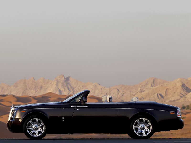 Black Rolls-Royce convertible in desert