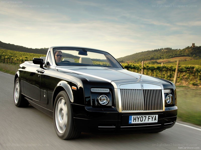 Black Rolls-Royce convertible on road
