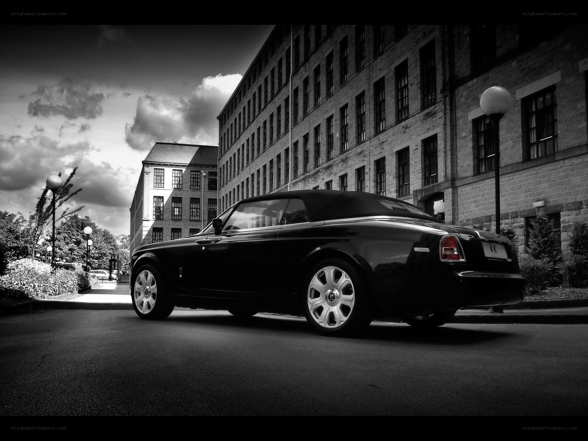 Black Rolls-Royce convertible on street