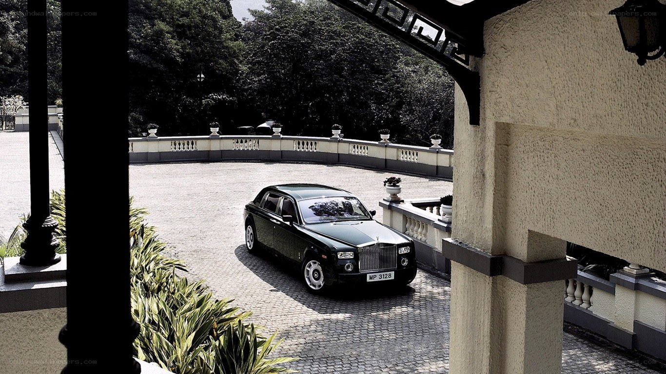 Black Rolls-Royce in courtyard