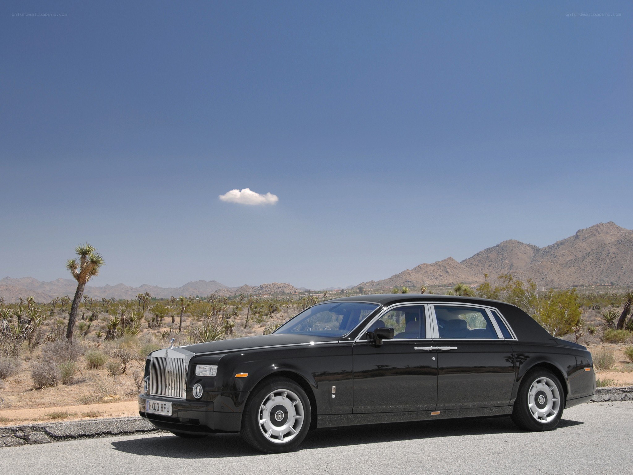 Black Rolls-Royce in desert