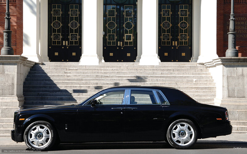 Black Rolls-Royce in front of building