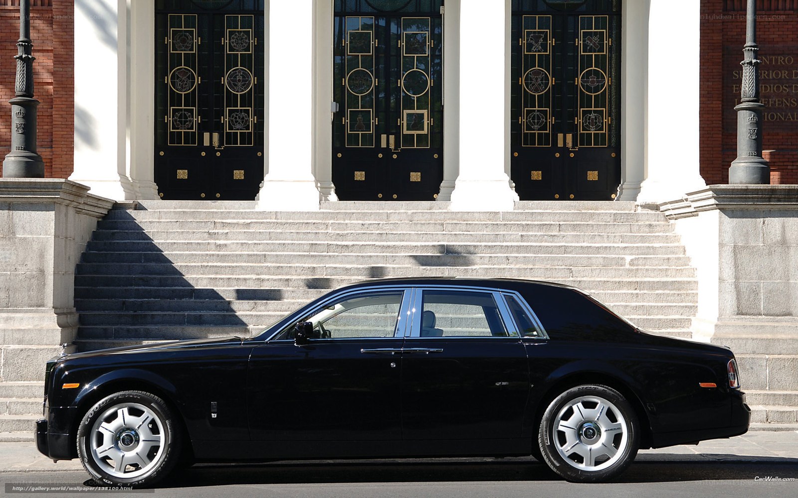 Black Rolls-Royce in front of building