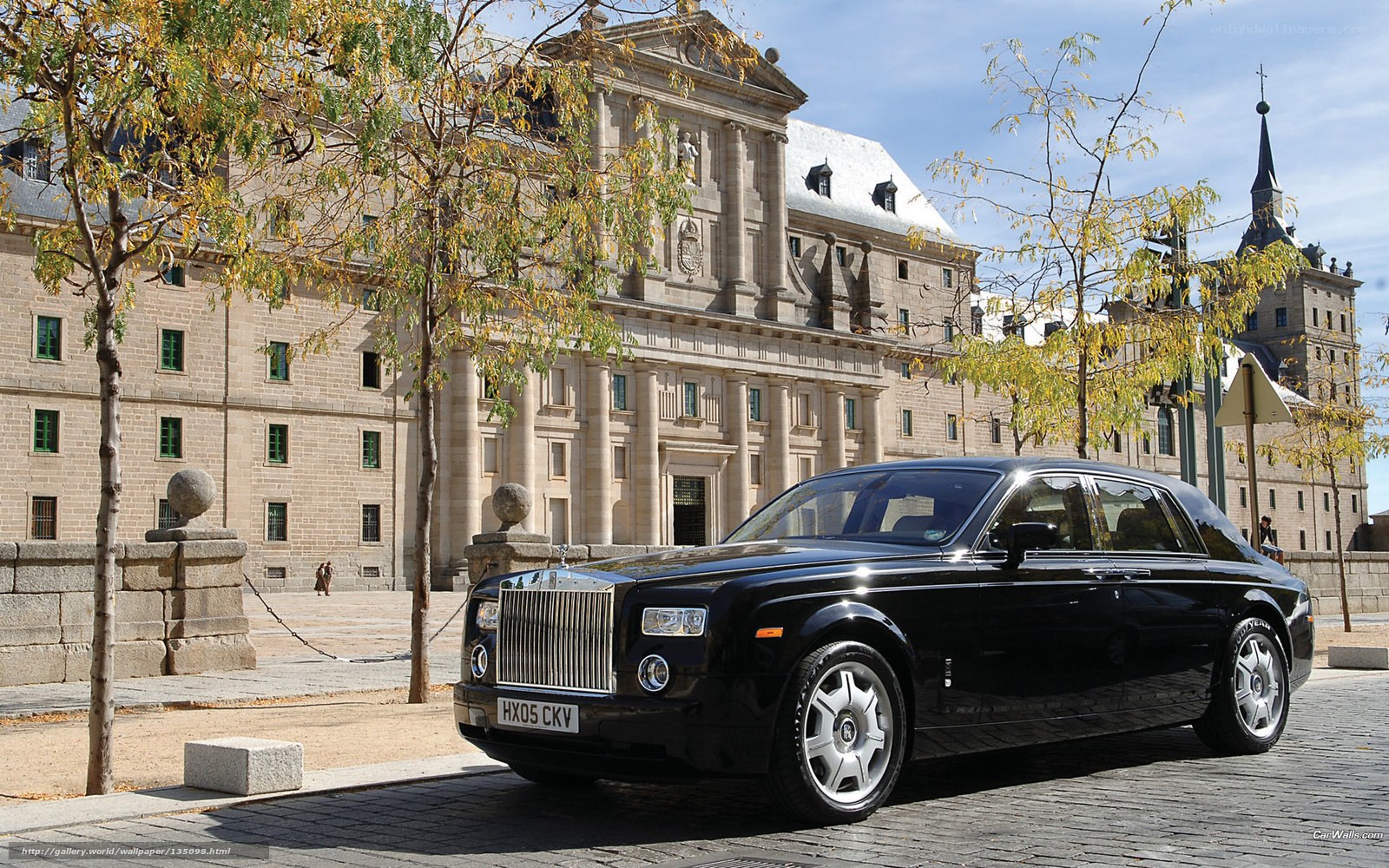 Black Rolls-Royce in front of palace