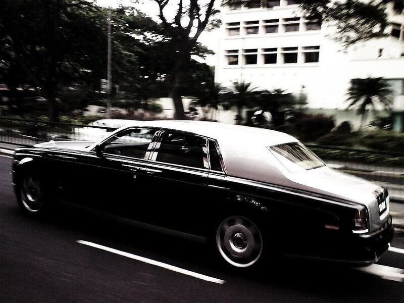 black rolls-royce in motion