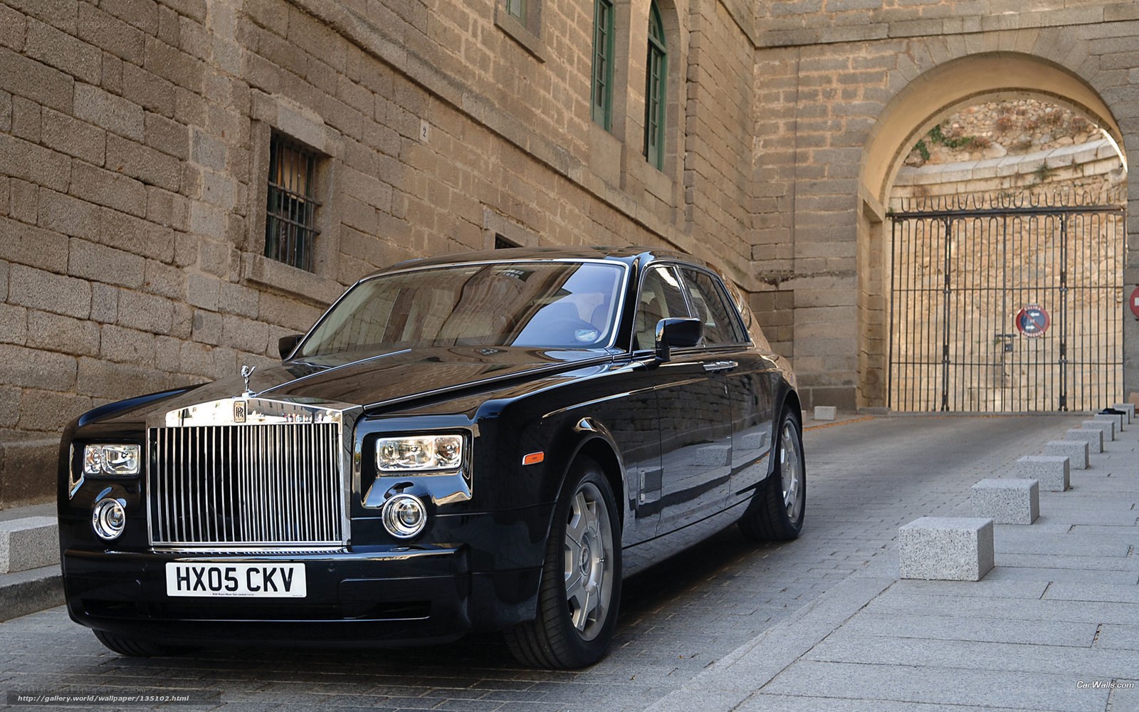 Black Rolls-Royce in stone alley