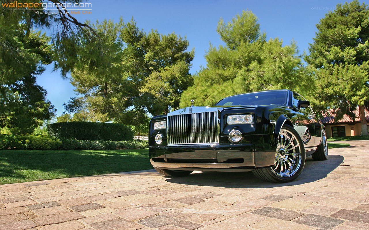 Black Rolls-Royce on a driveway