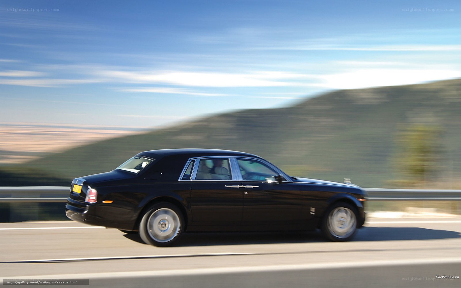 Black Rolls-Royce on a highway