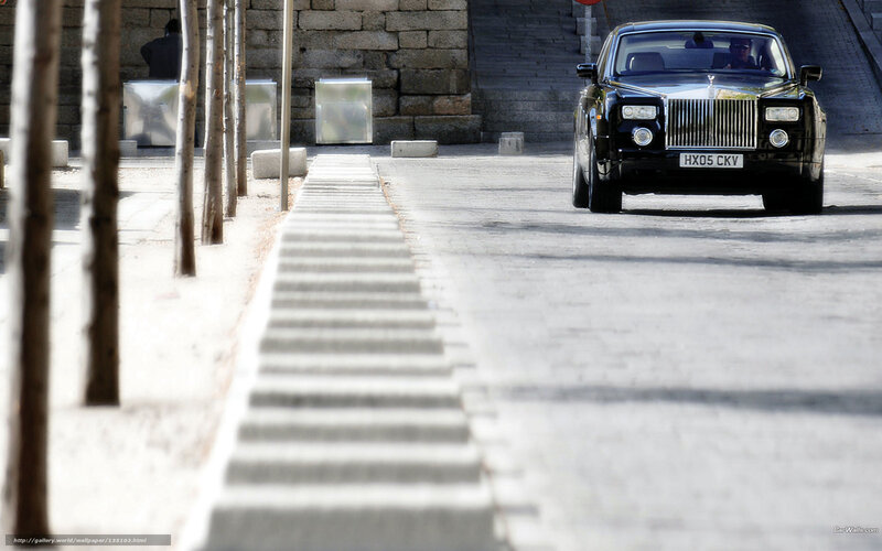 Black Rolls-Royce on city street
