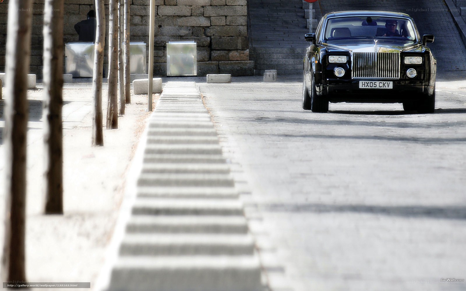 Black Rolls-Royce on city street