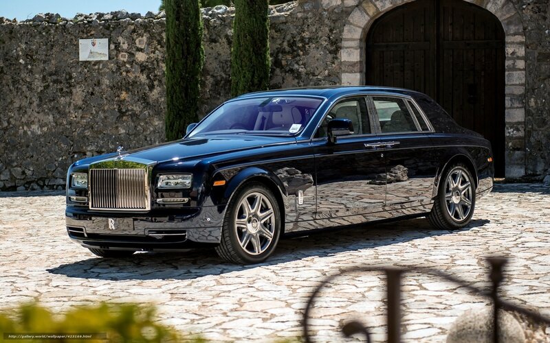 Black Rolls-Royce on cobblestone