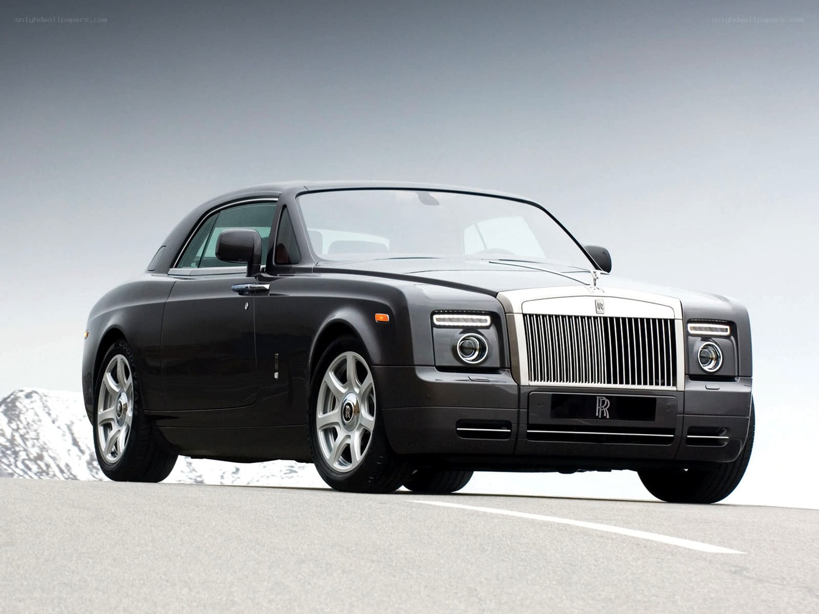 Black Rolls-Royce on mountain road