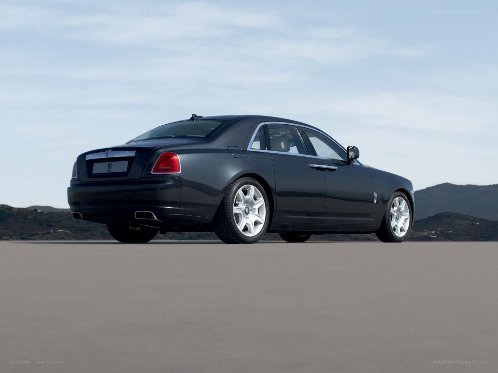 Black Rolls-Royce on open road
