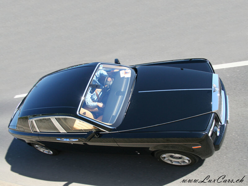 black rolls-royce on road