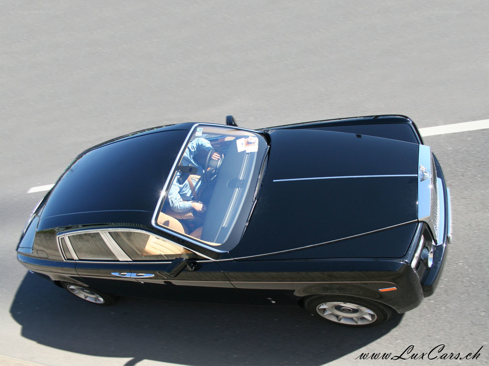 black rolls-royce on road