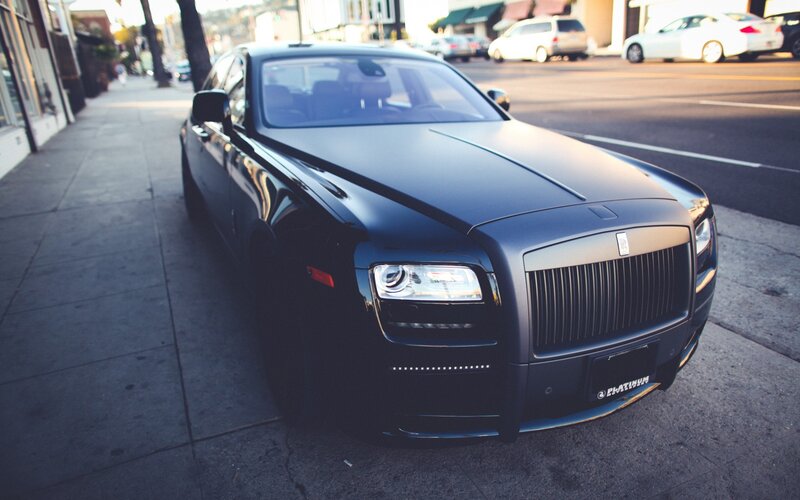Black Rolls-Royce on Sidewalk