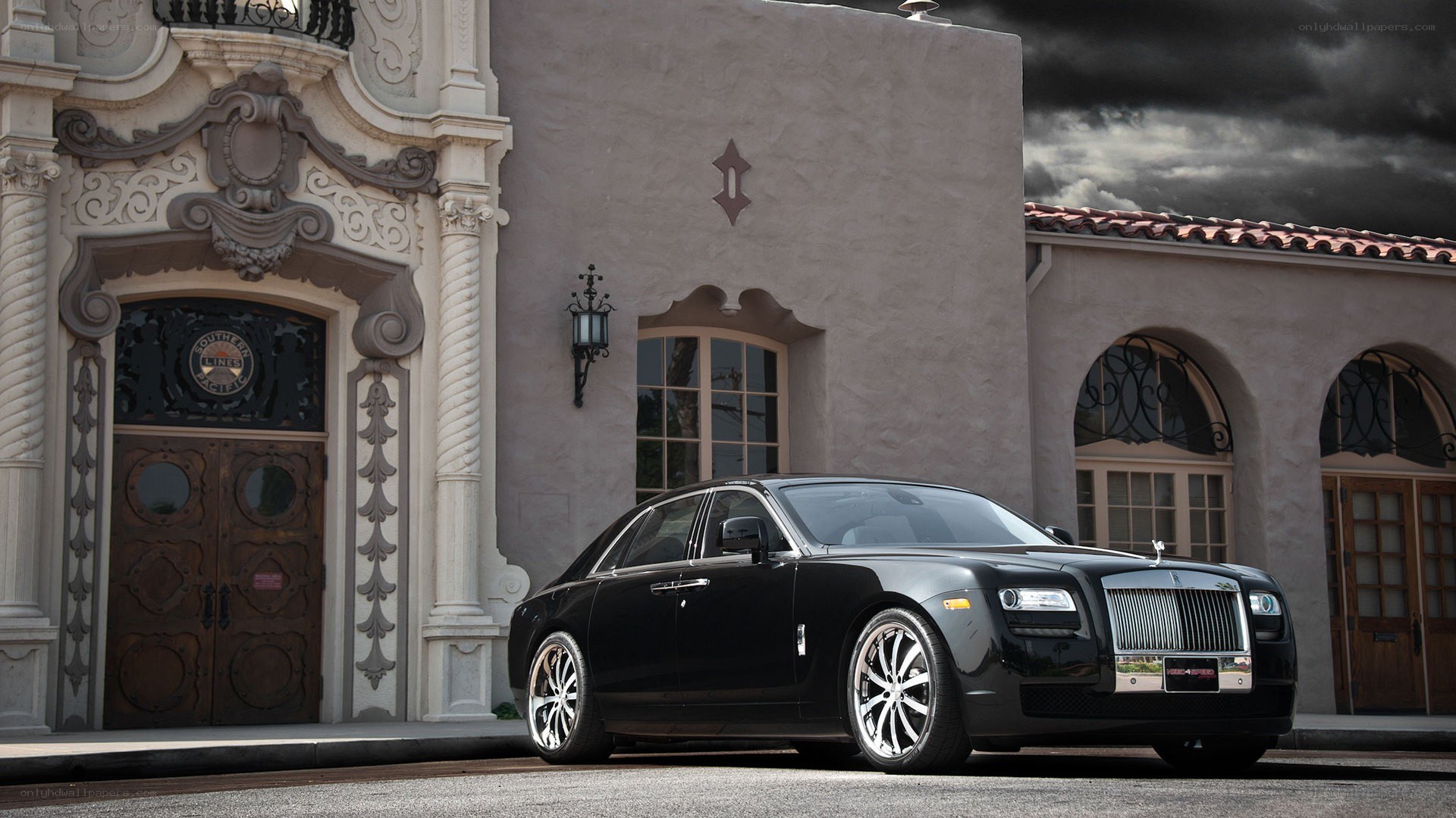 Black Rolls-Royce outside ornate building